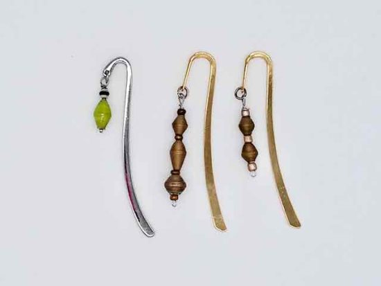 Photo of metal bookmarks available for purchase. This set shows 3 different shiny metal bookmarks with a beaded hanging dangle in various colors of small beads.