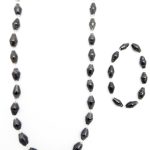 Women's matching beaded necklace and bracelet set with black paper beads. Handcrafted with paper beads by Ugandan women artisans.