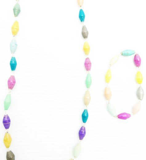 Women's matching beaded necklace and bracelet set in pastel multicolors bead colors. Handcrafted with paper beads by Ugandan women artisans.