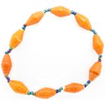 Orange bead bracelet closeup, The stretch bracelet contains 10 paper beads separated by seed beads.