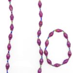 Women's matching beaded necklace and bracelet set in purple color. Handcrafted with paper beads by Ugandan women artisans.