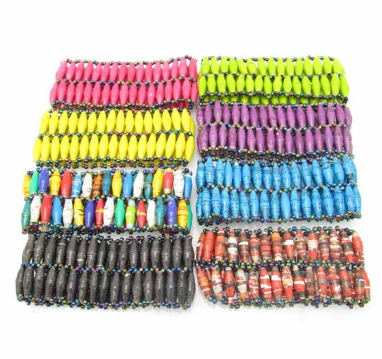 Grouping of eight two-row beaded stretch bracelets for women in a variety of solid and patterned colors.