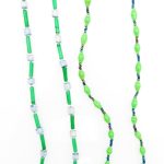 Two green beaded eyeglass leashes handcrafted from paper beads.