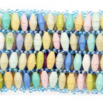 Women's pastel multi-color stretch bracelet containing 4 small narrow rows of beads that is available for purchase.