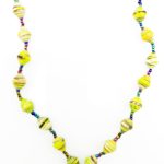 Yellow with black flecks lanyard made of paper beads with a small seed bead loop at the bottom and a metal clip to attach your badge. The lanyard is shown on a plain white background. The top of the lanyard is not visible.