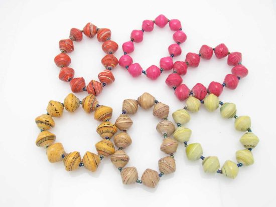 Grouping of 6 round bead stretch bracelets in reds, pinks, yellows and oranges.