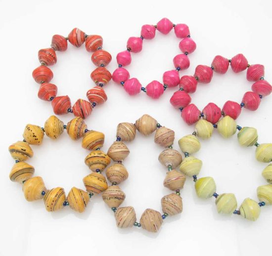 Grouping of 6 round bead stretch bracelets in reds, pinks, yellows and oranges.