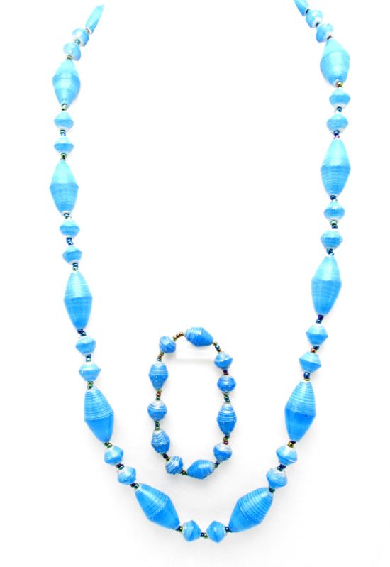 Women's matching beaded necklace and bracelet set in sky blue small & large oval bead pattern. Handcrafted with paper beads by Ugandan women artisans.