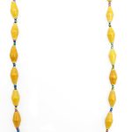 Golden yellow paper bead necklace on a plain white background. The top of the necklace is not visible.