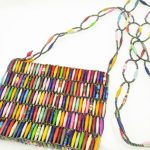 Photo of a strapped beaded purse with lots of vibrant multi-color beads. This vibrant small thinner purse is handmade and available for purchase