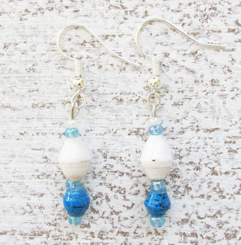 Photo of a pair of two-bead earrings with a top white bead and smaller turquoise color bead on the bottom. These handcrafted earrings are available to purchase.