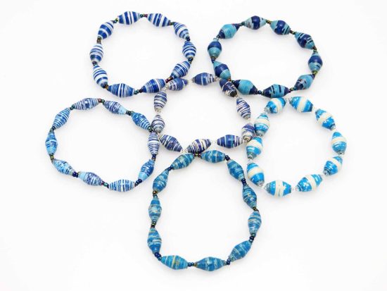 Photo of a grouping of 6 basic single strand stretch bracelets. Each bracelet is demonstrating the different kinds of blue striped patterns that might be available for purchase.