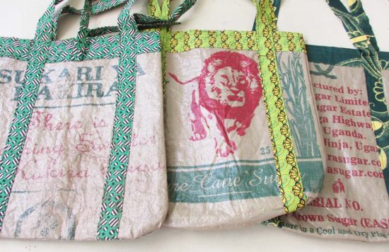 Photo of 3 market style shopping bags available to purchase. These bags each have a different green patterned trim.