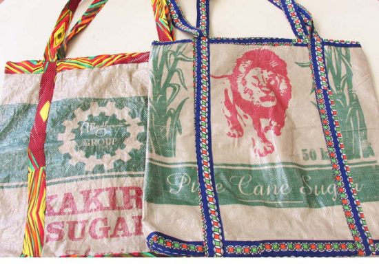 Photo of 2 market style shopping bags available to purchase. One bag has multi-color trim and the 2nd has blue patterned trim.