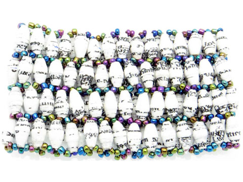 Women's white with flecks stretch bracelet containing 4 small narrow rows of beads that is available for purchase.