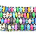 Women's multi-color stretch bracelet containing 4 small narrow rows of beads that is available for purchase.