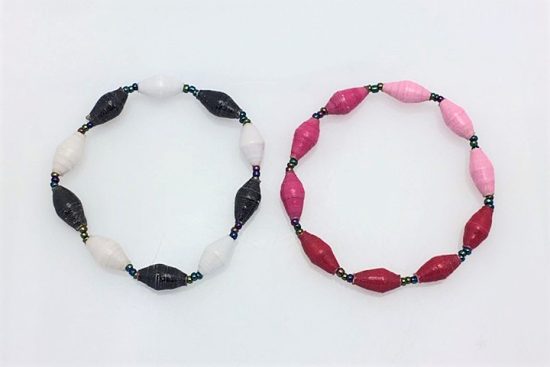 Photo of 2 women's single strand bracelet that you can special order with a special color combination. Shown are one bracelet with black and white alternating beads. The 2nd bracelet contains 3 different shades of pink beads.