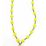 True yellow lanyard made of paper beads with a small seed bead loop at the bottom and a metal clip to attach your badge. The lanyard is shown on a plain white background. The top of the lanyard is not visible.