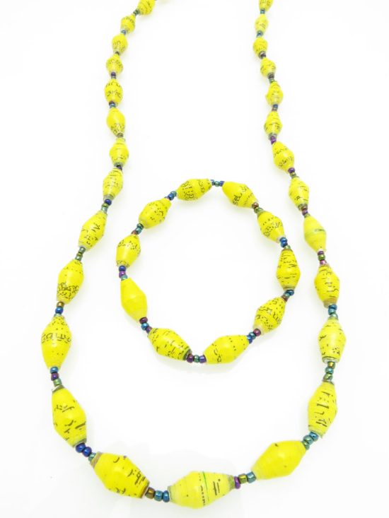 Women's matching beaded necklace and bracelet set in yellow with flecks color. Handcrafted with paper beads by Ugandan women artisans.