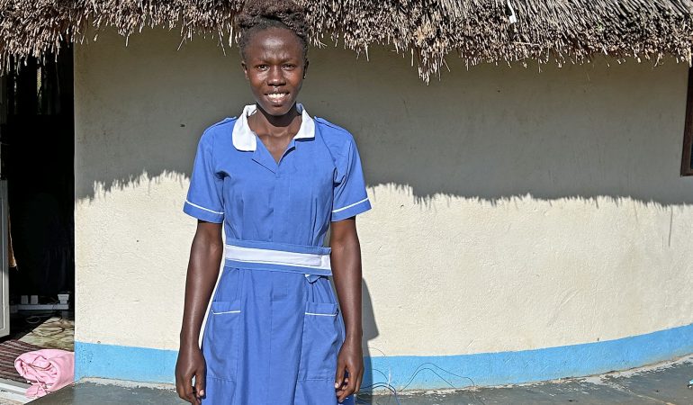 Nurse Winifred in front of Agwata clinic