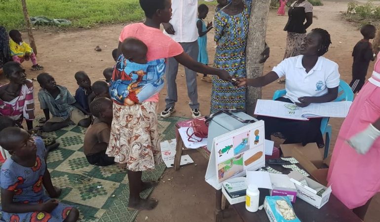 Dispensing life saving malaria medicines in this northern Uganda village